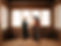 A constructor, a woman and a man looking at architectural plans